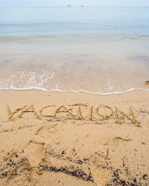 Palabra de vacaciones en la arena — Foto de Stock