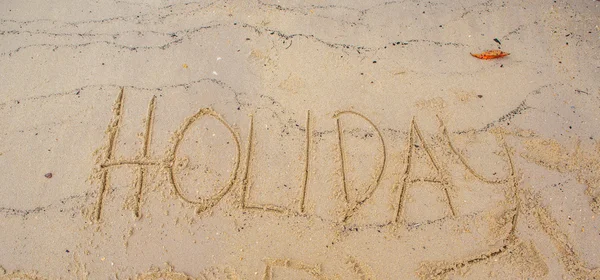 Holiday word på sand — Stockfoto
