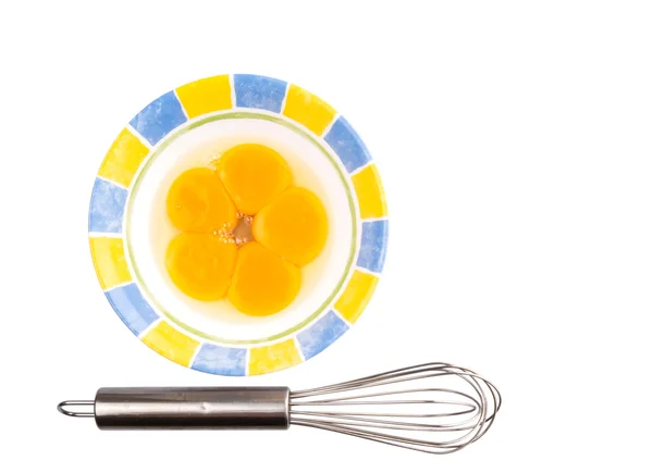 Gema de ovo e batedor de ovo — Fotografia de Stock