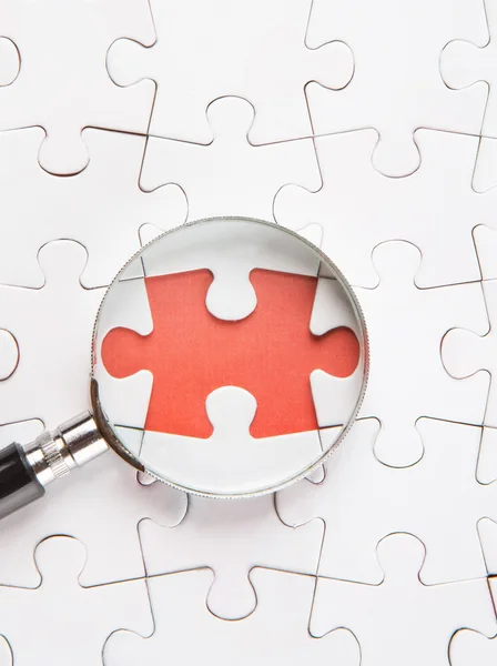 Missing Puzzle And Magnifying Glass — Stock Photo, Image