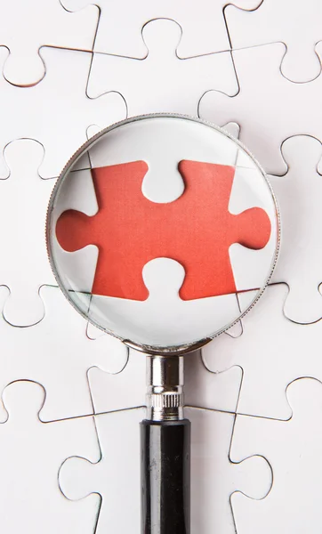 Missing Puzzle And Magnifying Glass — Stock Photo, Image