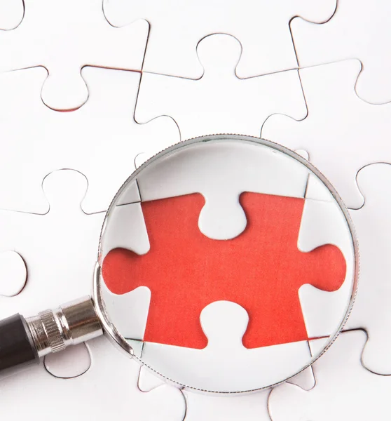 Missing Puzzle And Magnifying Glass — Stock Photo, Image