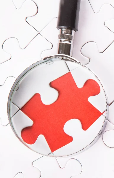 Missing Puzzle And Magnifying Glass — Stock Photo, Image