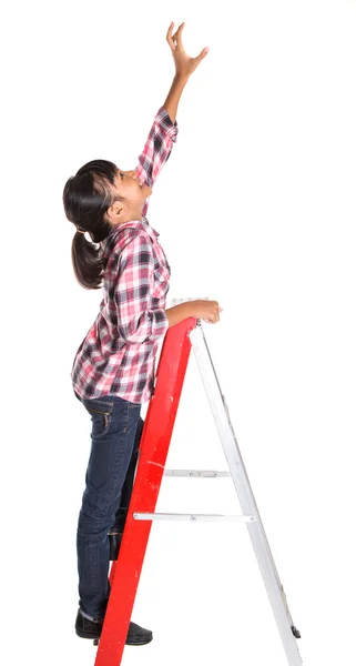 Jong meisje op een ladder — Stockfoto