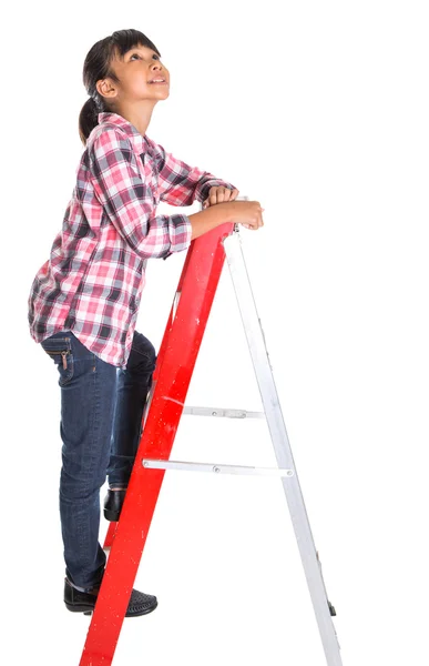 Jong meisje op een ladder — Stockfoto