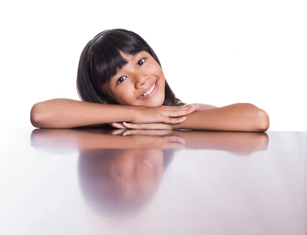 Girl  on a wooden table — Stock Photo, Image