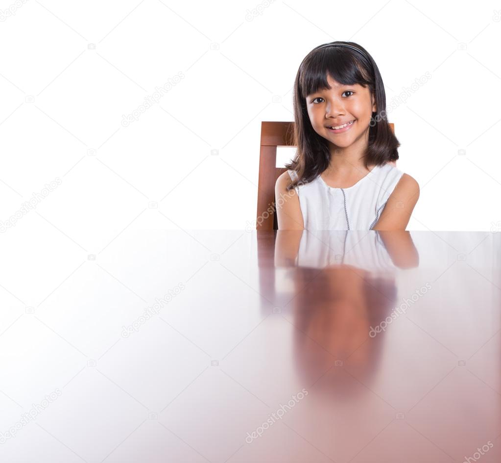 Girl  on a wooden table