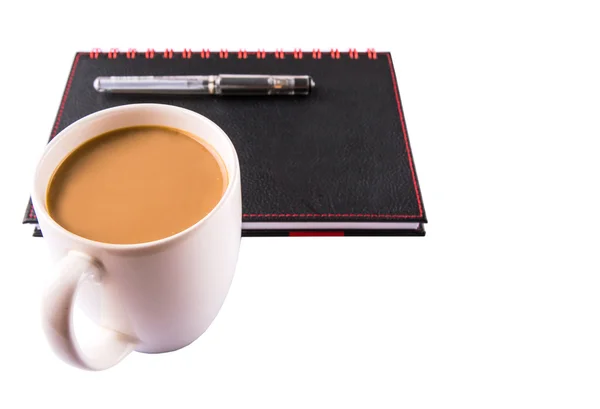 Notebook, kaffe och kulspetspenna — Stockfoto