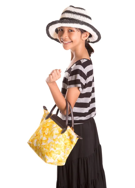 Jong meisje met gele handtas — Stockfoto