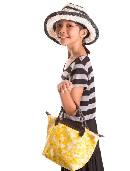 Jong meisje met gele handtas — Stockfoto