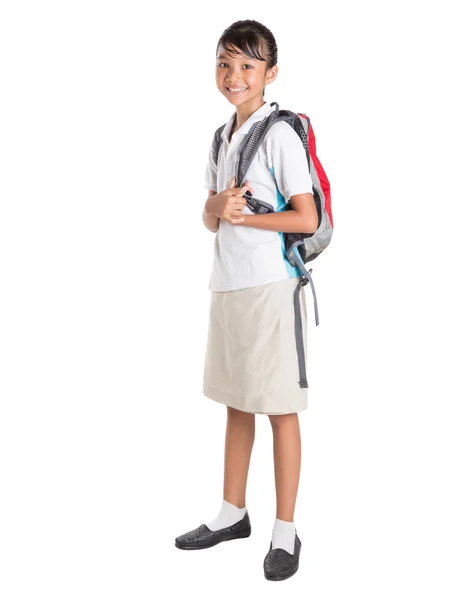 Mädchen in Schuluniform und Rucksack — Stockfoto