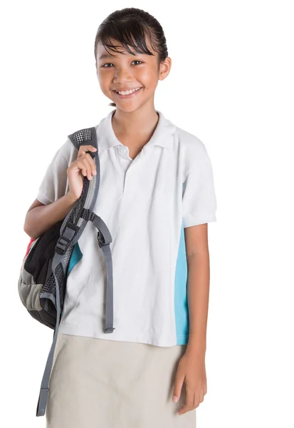 Meisje in schooluniform en rugzak — Stockfoto