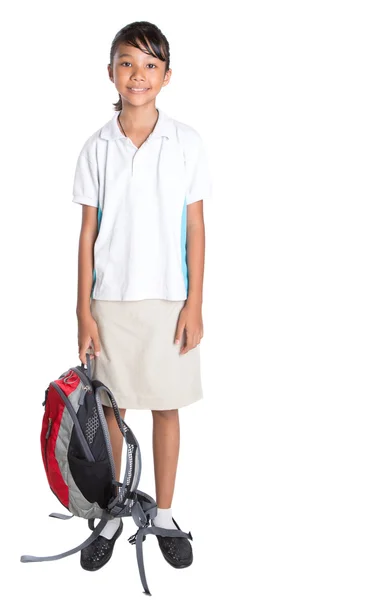 Meisje in schooluniform en rugzak — Stockfoto