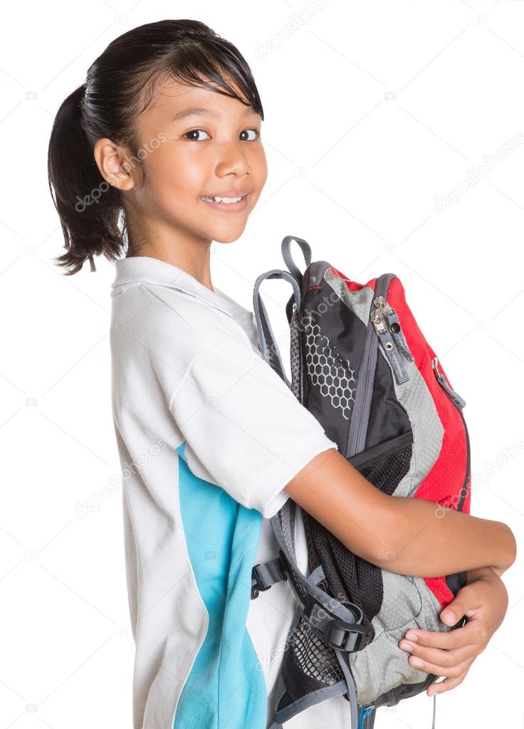 Girl In School Uniform And Backpack