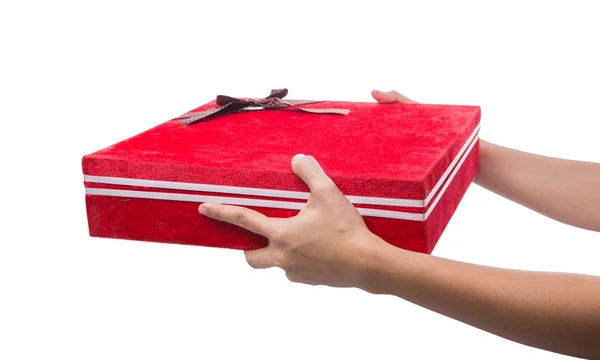 Держа в руках красную подарочную коробку — стоковое фото