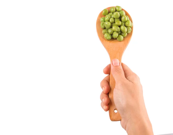 Vrouwelijke hand bedrijf groene erwten — Stockfoto