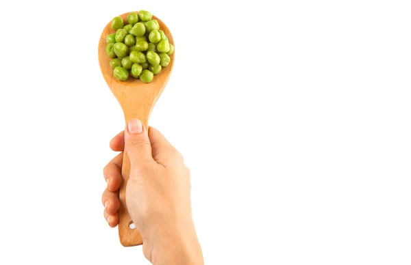 Vrouwelijke hand bedrijf groene erwten — Stockfoto