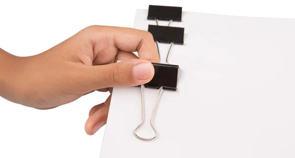 Hand met wit papier met bindmiddel clips — Stockfoto