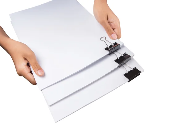 Hand holding white paper with binder clips — Stock Photo, Image