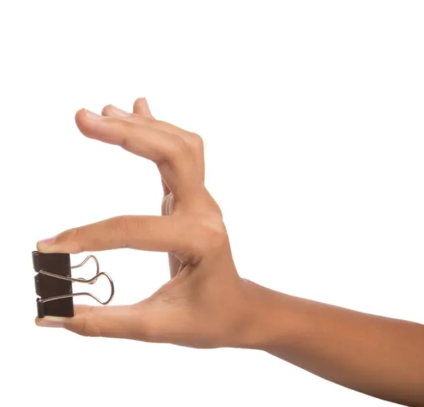 Kvinnlig hand innehav bindemedel klipp — Stockfoto