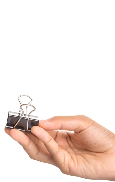 Female hand holding binder clip — Stock Photo, Image