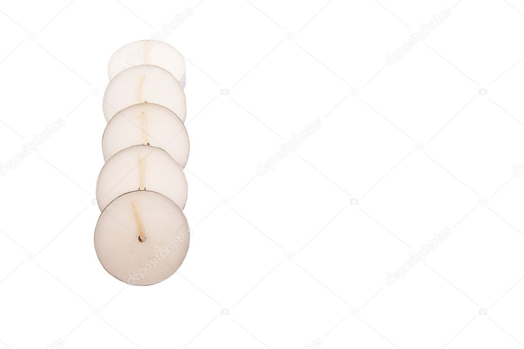 Small tealights over white background