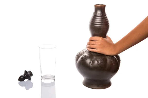 Pouring Water From Black Clay Water Pitcher — Stock Photo, Image