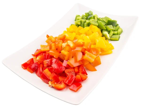 Πολύχρωμες πιπεριές ψιλοκομμένα σε ένα πιάτο — Φωτογραφία Αρχείου