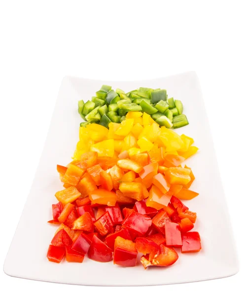 Bir tabak içinde renkli doğranmış capsicums — Stok fotoğraf