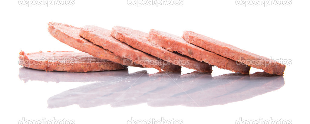 Frozen raw hamburger beef meat over white background