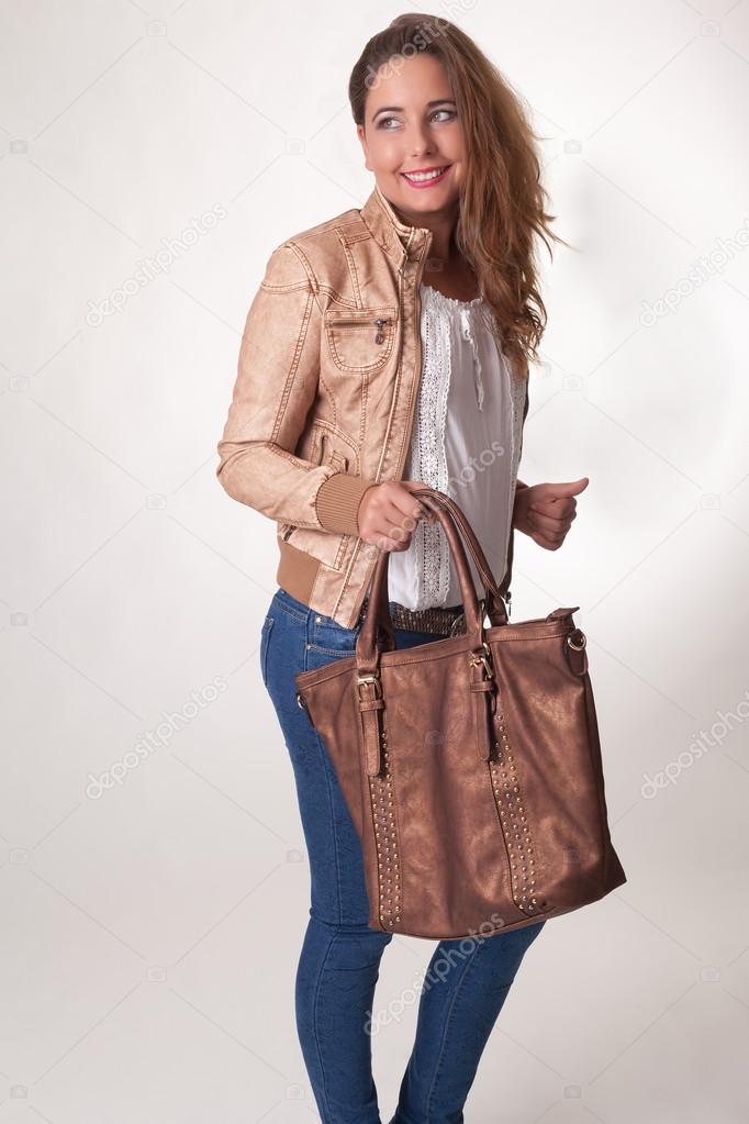 Stylish young woman with a handbag