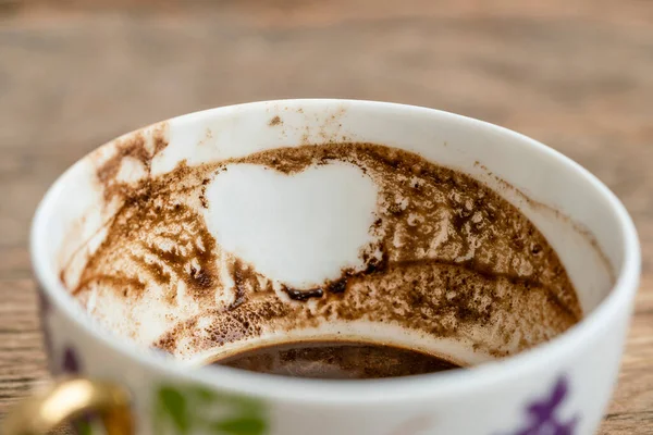 coffee fortune, closeup heart shape in Turkish coffee grounds with selective focus for fortune telling. Fortune telling from cup is Turkish tradition in Turkey.