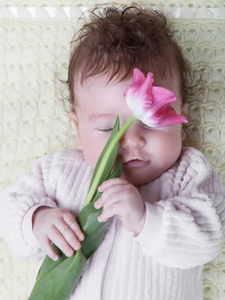 Baby with flowers — Stock Photo, Image