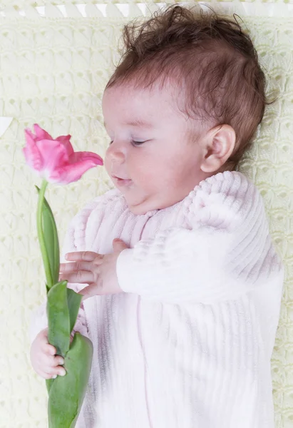 Baby with flowers — Stock Photo, Image