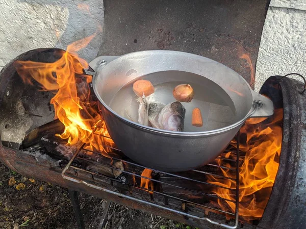 making homemade soup. delicious homemade soup. Ladle with vegetable soup. Cooking pot on background. Focus on foreground. Bowl of tasty chicken enchilada soup