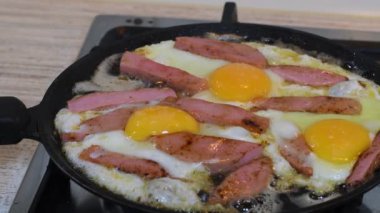 omelette. cooking eggs. Fried eggs fried eggs from 6 eggs fried in a pan. Hot appetizing dish that is eaten unmarried men and poor students. Different ways of cooking eggs.