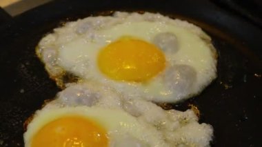 omelette. cooking eggs. Fried eggs fried eggs from 6 eggs fried in a pan. Hot appetizing dish that is eaten unmarried men and poor students. Different ways of cooking eggs.