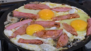 omelette. cooking eggs. Fried eggs fried eggs from 6 eggs fried in a pan. Hot appetizing dish that is eaten unmarried men and poor students. Different ways of cooking eggs.