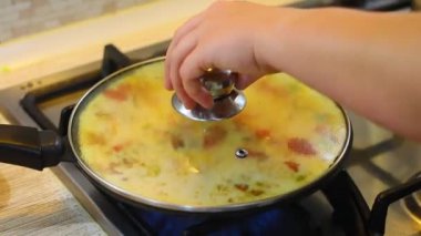 omelette. cooking eggs. Fried eggs fried eggs from 6 eggs fried in a pan. Hot appetizing dish that is eaten unmarried men and poor students. Different ways of cooking eggs.