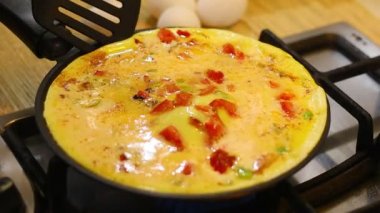 omelette. cooking eggs. Fried eggs fried eggs from 6 eggs fried in a pan. Hot appetizing dish that is eaten unmarried men and poor students. Different ways of cooking eggs.