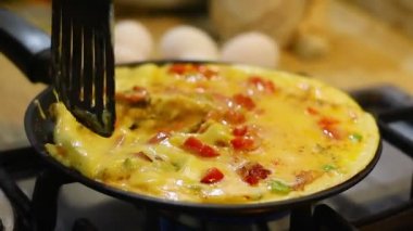 omelette. cooking eggs. Fried eggs fried eggs from 6 eggs fried in a pan. Hot appetizing dish that is eaten unmarried men and poor students. Different ways of cooking eggs.