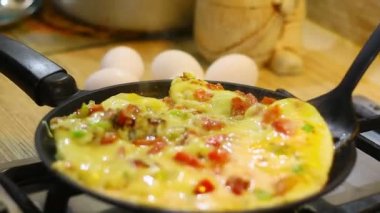 omelette. cooking eggs. Fried eggs fried eggs from 6 eggs fried in a pan. Hot appetizing dish that is eaten unmarried men and poor students. Different ways of cooking eggs.