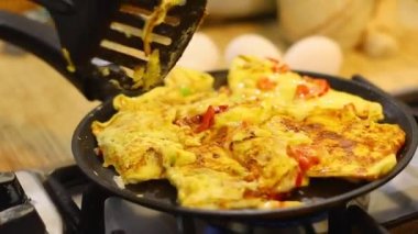 omelette. cooking eggs. Fried eggs fried eggs from 6 eggs fried in a pan. Hot appetizing dish that is eaten unmarried men and poor students. Different ways of cooking eggs.