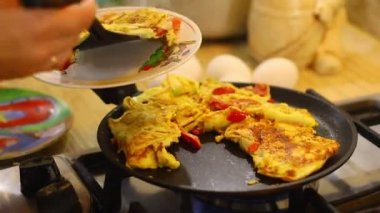 omelette. cooking eggs. Fried eggs fried eggs from 6 eggs fried in a pan. Hot appetizing dish that is eaten unmarried men and poor students. Different ways of cooking eggs.