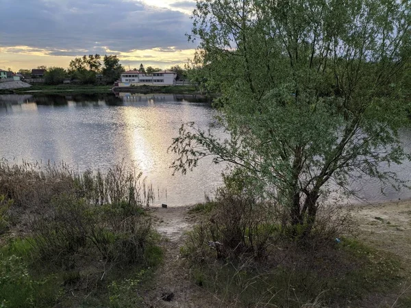 stock image natural landscape with water. sunset and sunrise on the water. beautiful river. Lake Shore. reflection in the water. water flow. recreation on the shore of the reservoir.