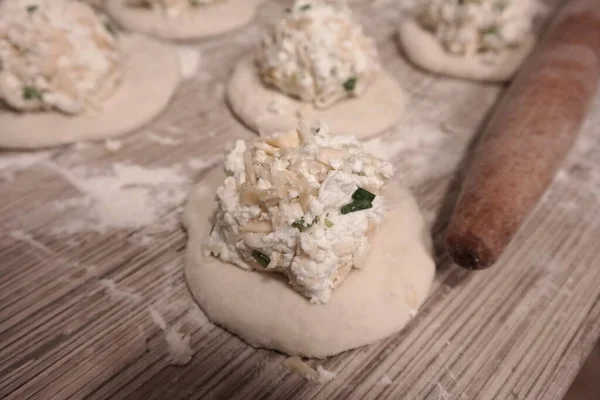 making cakes. cakes with cheese. dough. bread with cheese. cooking bread.Fried quesadillas with cheddar cheese and hot pepper in a cast iron pan. Making delicious and traditional Cheese Bread