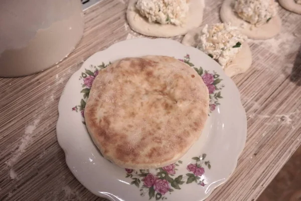 making cakes. cakes with cheese. dough. bread with cheese. cooking bread.Fried quesadillas with cheddar cheese and hot pepper in a cast iron pan. Making delicious and traditional Cheese Bread