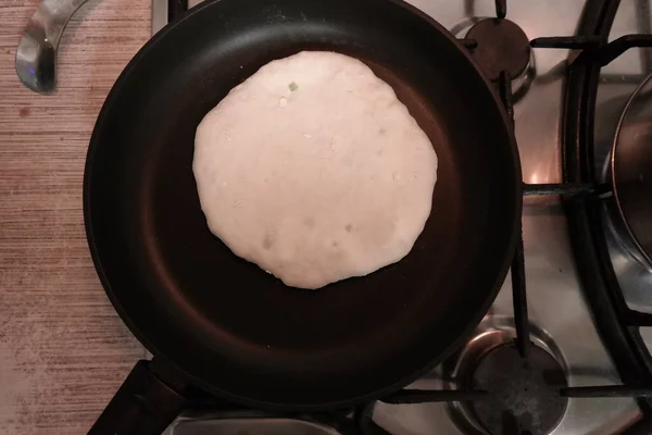 making cakes. cakes with cheese. dough. bread with cheese. cooking bread.Fried quesadillas with cheddar cheese and hot pepper in a cast iron pan. Making delicious and traditional Cheese Bread