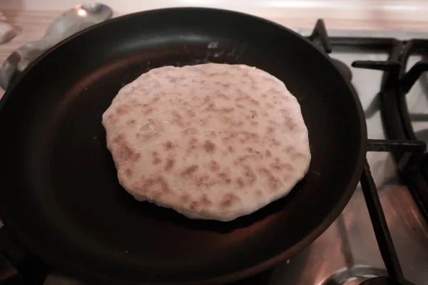 making cakes. cakes with cheese. dough. bread with cheese. cooking bread.Fried quesadillas with cheddar cheese and hot pepper in a cast iron pan. Making delicious and traditional Cheese Bread