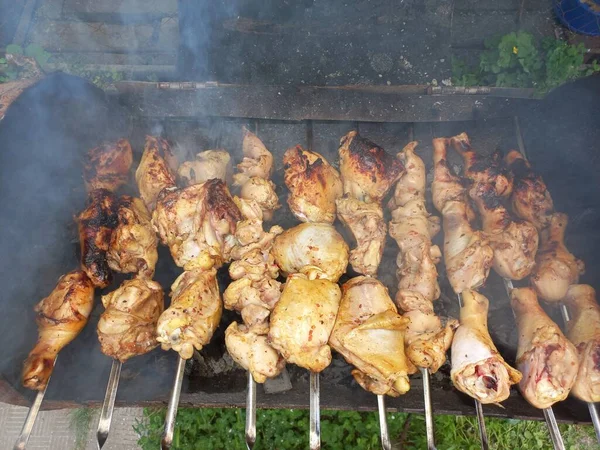 chicken on the grill. fried chicken on fire. meat on skewers. chicken kebab. cooking meat on fire. home grill. barbecue food.